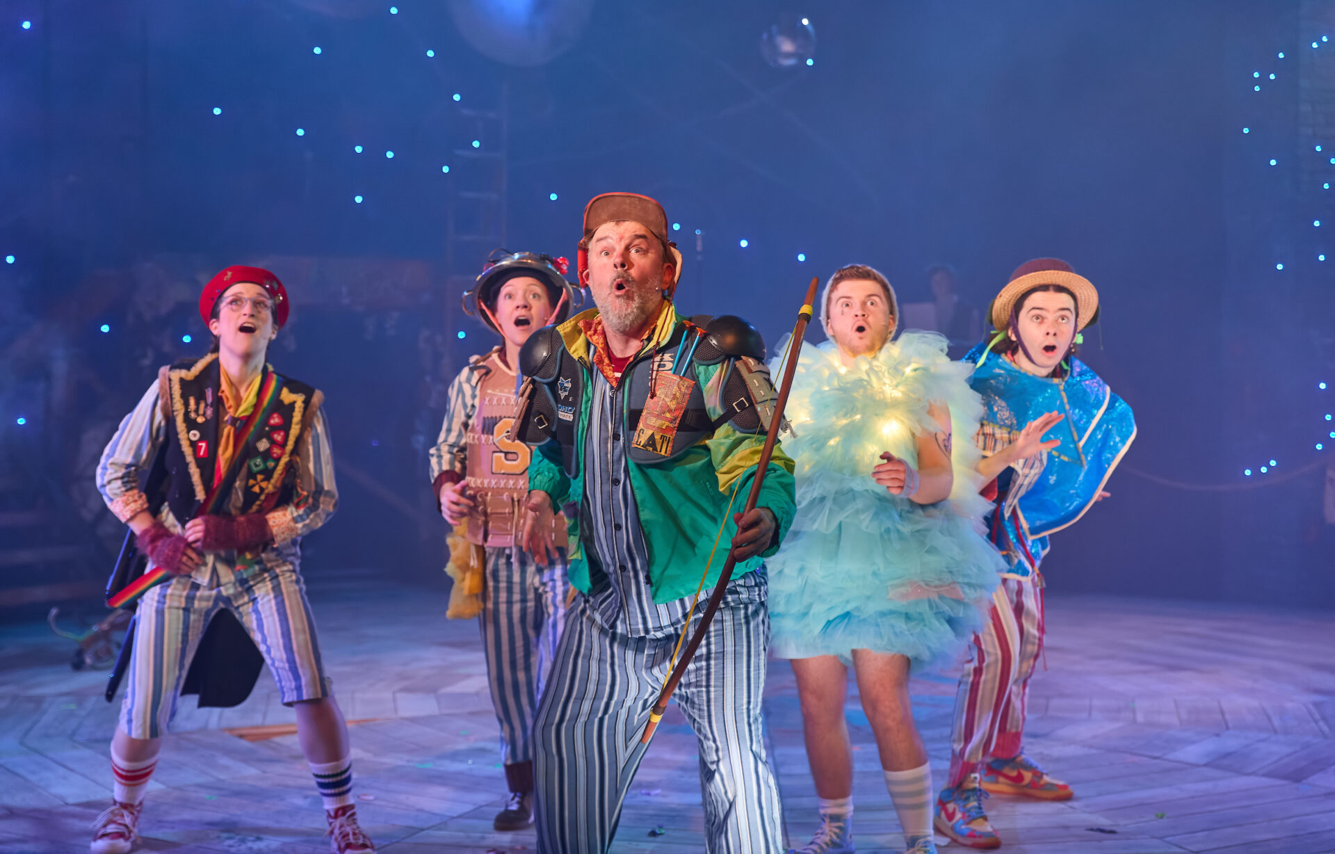 Lynwen Haf Roberts (Nibs / Musical Director), Rebecca Killick (Tiger / Nana / Slightly), Keiron Self (Smee / Mr Darling / Tootles), Owen Alun (Tink / Skylights) and Edward Lee (Apprentice Actor) in Peter Pan. Image: Mark Douet